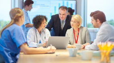 A group of healthcare professionals in a meeting room